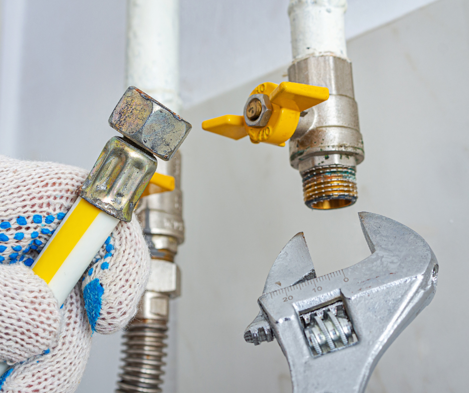 A technician fixes a gas leak in a home