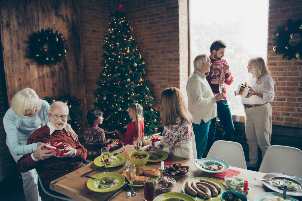 Family Christmas party with holiday guests at home