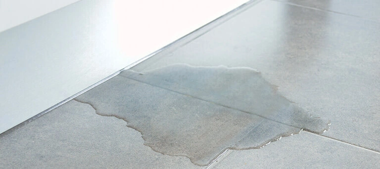 water leaking from a crack in the slab